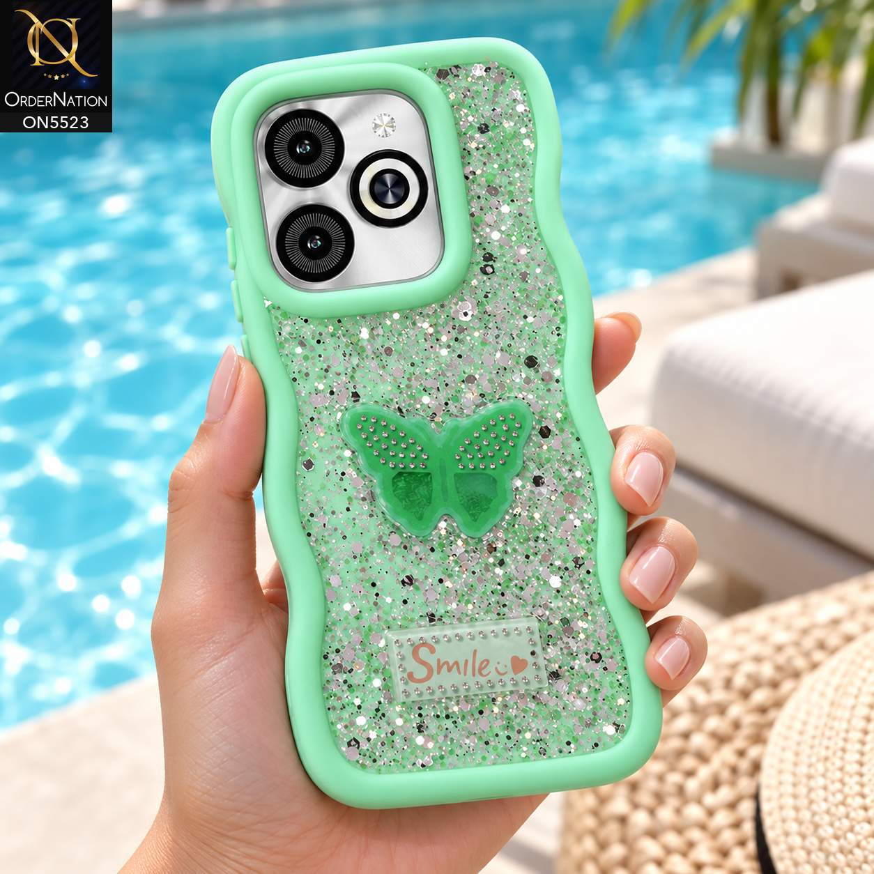 Infinix Smart 8 HD Cover - Sea Green - New Premium Smile Glitter Soft Case on the phone, held in a hand by a swimming pool (AI lifestyle render)