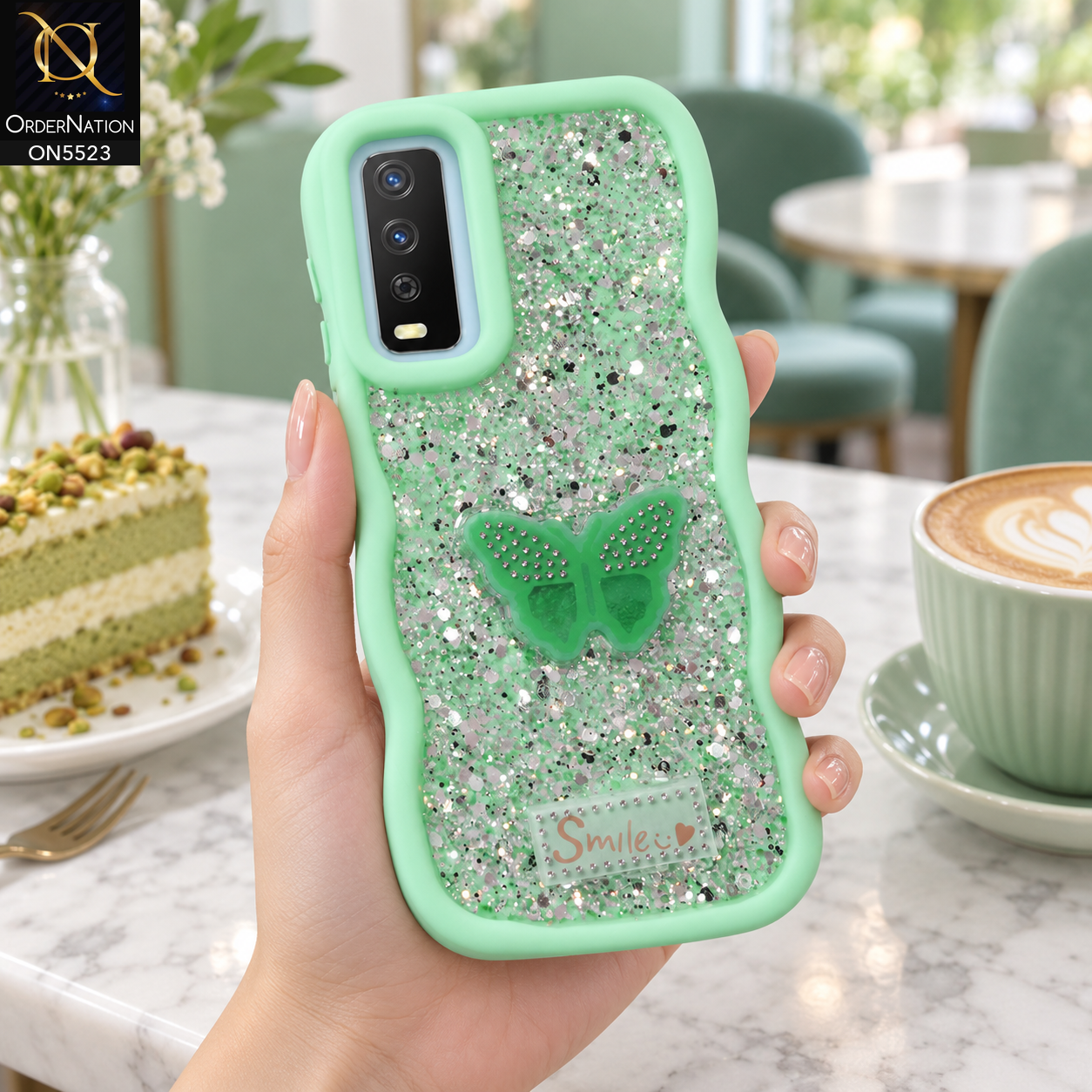 Vivo Y12a Cover - Sea Green - New Premium Smile Glitter Soft Case on the phone, held in a hand in a mint cafe (AI lifestyle render)
