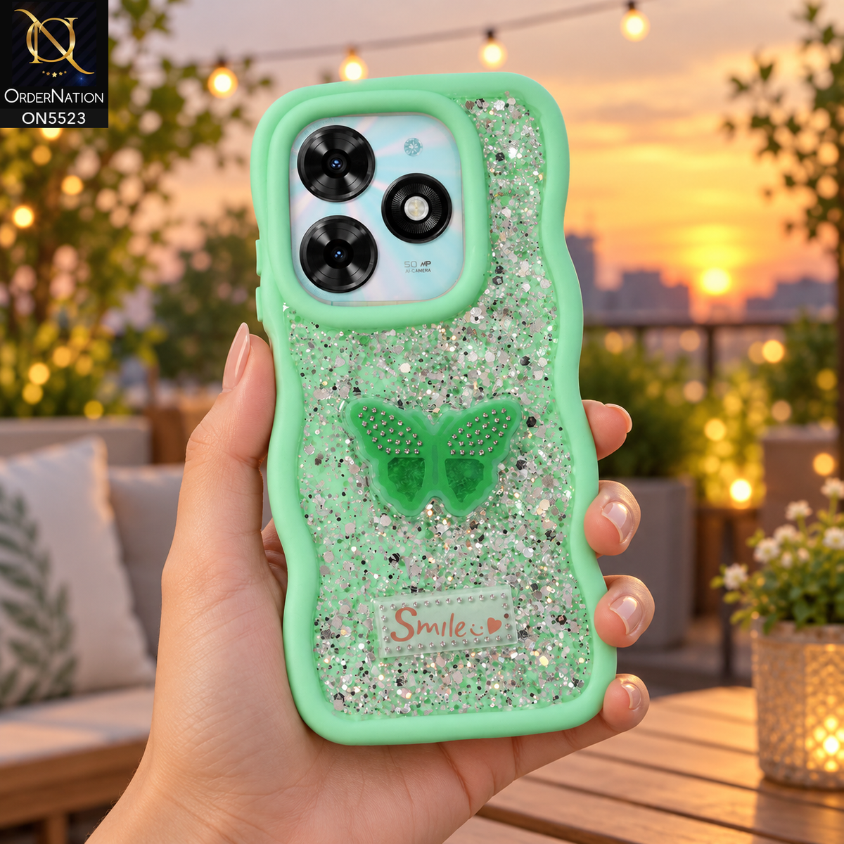 Tecno Spark 20C Cover - Sea Green - New Premium Smile Glitter Soft Case on the phone, held in a hand on a rooftop terrace at sunset (AI lifestyle render)