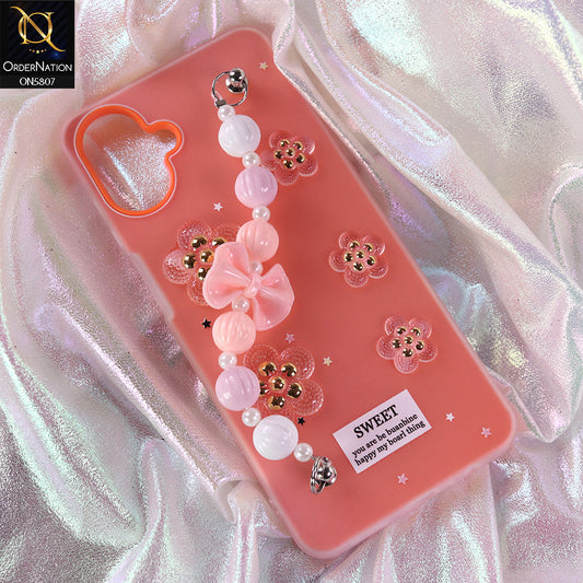 Samsung Galaxy M07 Cover - Orange - New Trendy Floral Bow Decor Beaded Hand Strap